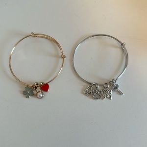 2 Charm bracelets. Comes together. Gold and silver.